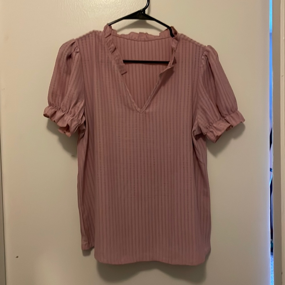 Ruffled pink blouse